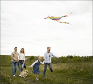full-shot-happy-family-flying-kite